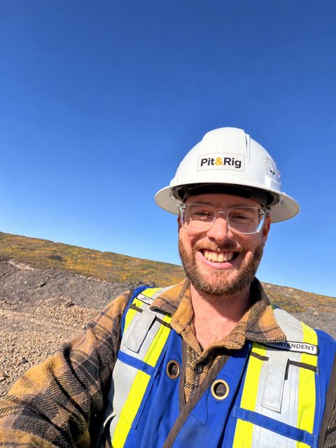 Jean-Pascal Remon on site in a white Pit & Rig hard hat, clear safety glasses and a blue hi-vis vest.